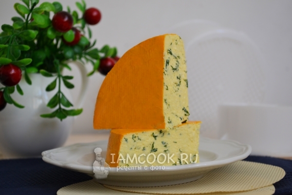 Photo of homemade curd cheese with greens