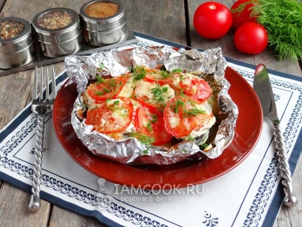 Photo of pink salmon with potatoes in foil in the oven