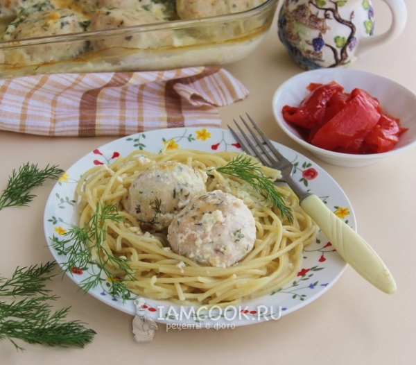 Photo of chicken meatballs in a creamy sauce in the oven