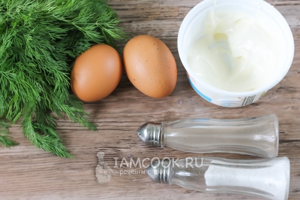 Ingredients for omelette with mayonnaise in a frying pan