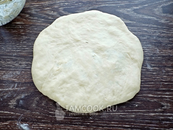 Mash the dough into a flat cake
