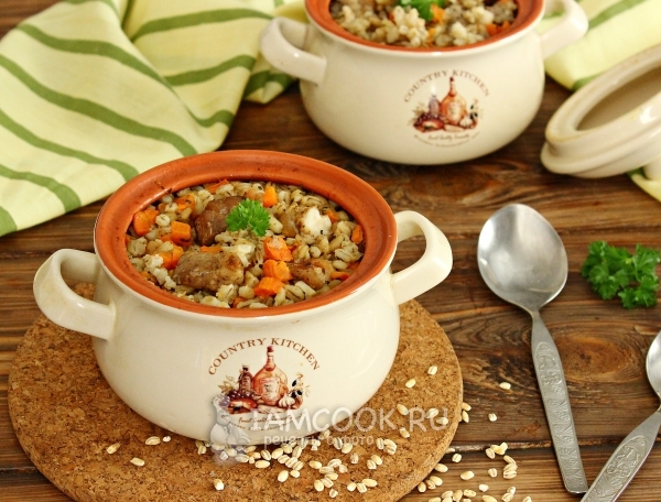 Photo of pearl barley with meat, cooked in a pot in the oven