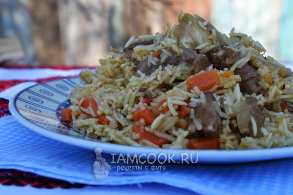 Pilaf in cauldron at the stake