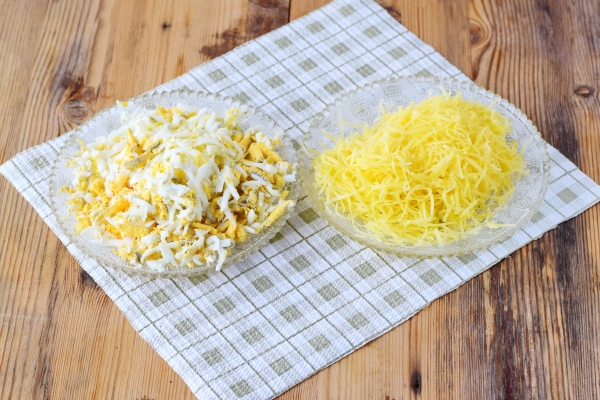 Rub eggs and grated cheese