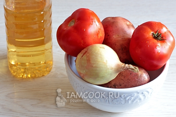 Ingredients for fried potatoes with tomatoes